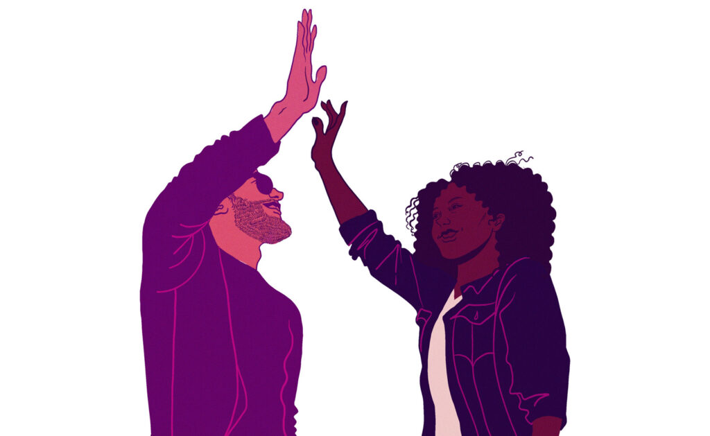 Two people high five against a white background.